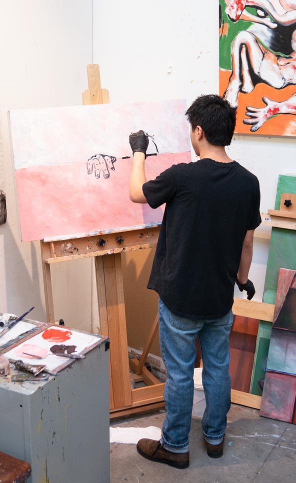 Person painting in their studio