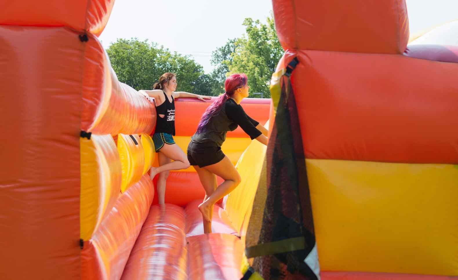 Students in a bouncy castle