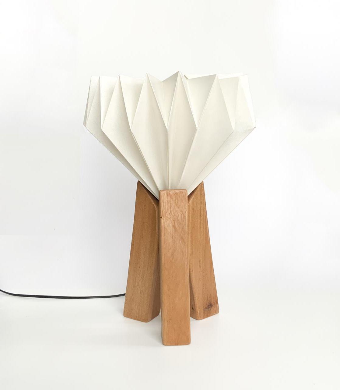 Innovative lamp design focusing on three wooden pillars.