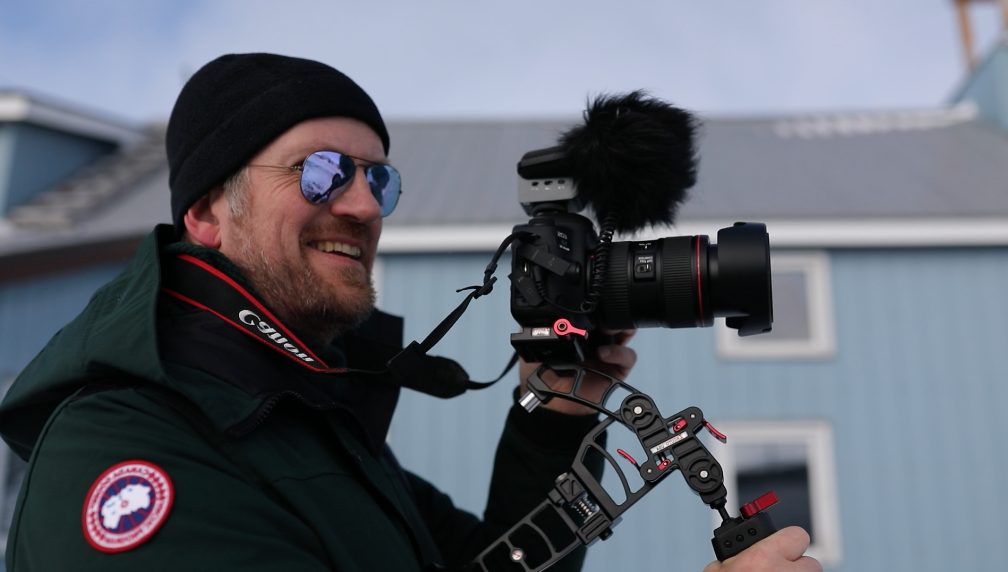 Dr. Olaf Kuhlke holding a camera